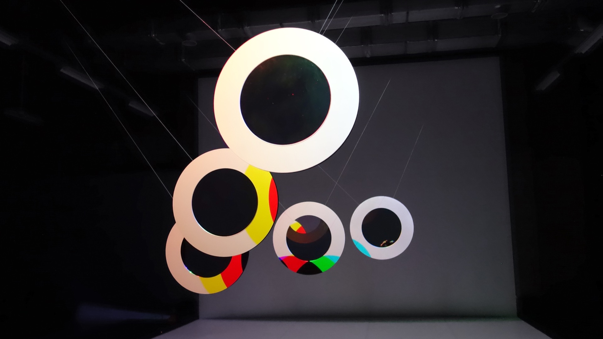 Triptych showing different color compositions of the installation