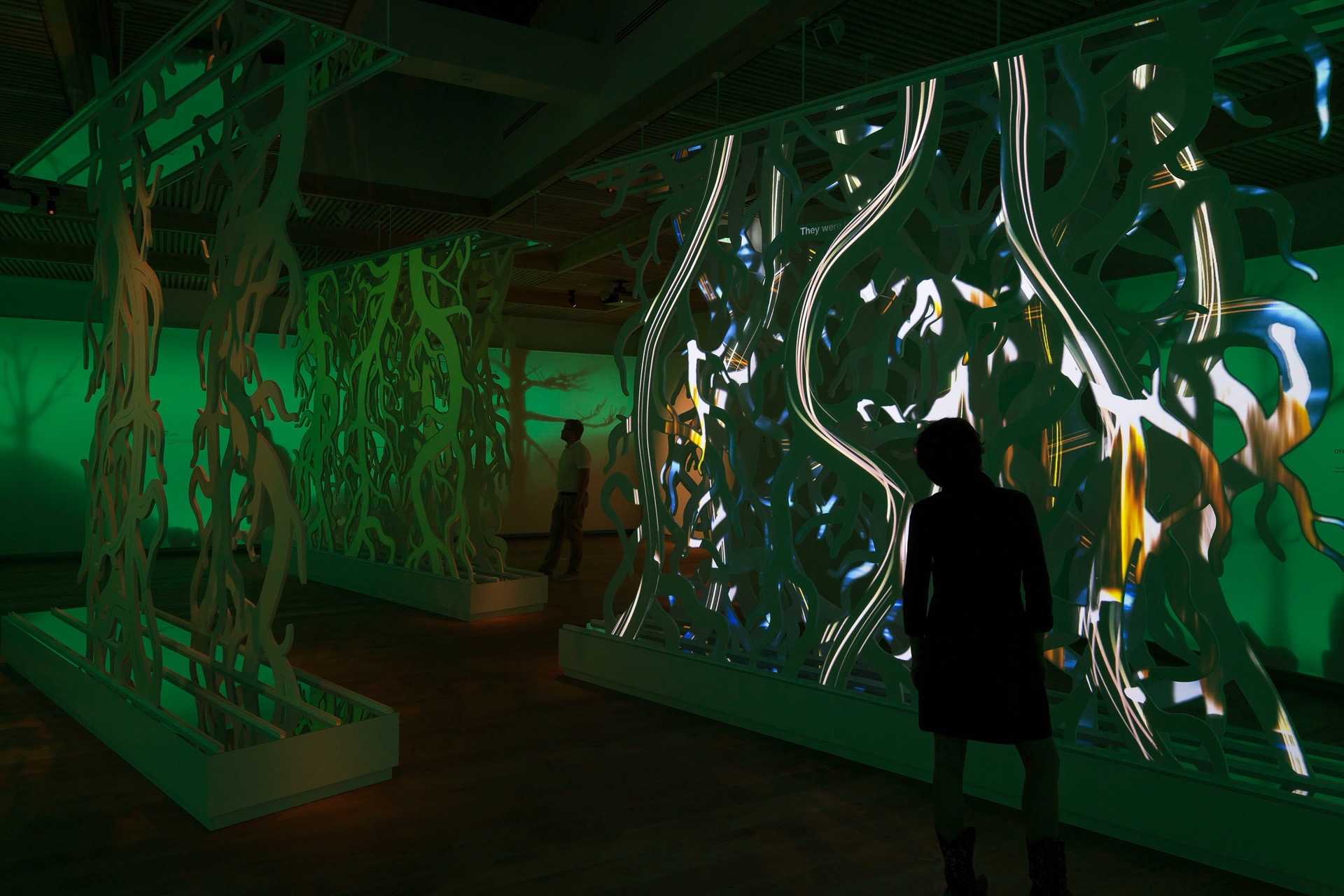 Visitor interacting with exhibition media elements